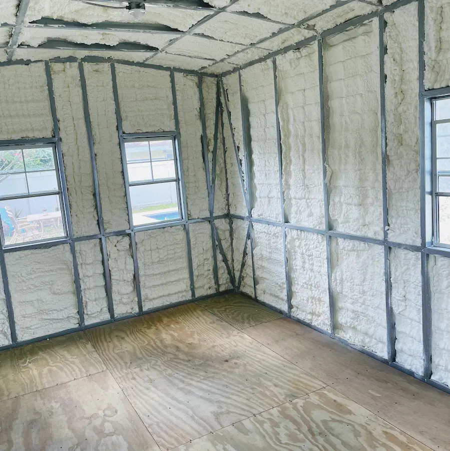 Closed-cell spray foam insulation applied to wall cavities in a residential project in Northfield